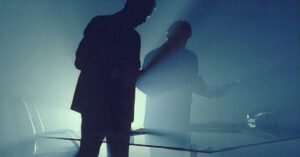 two men backlit