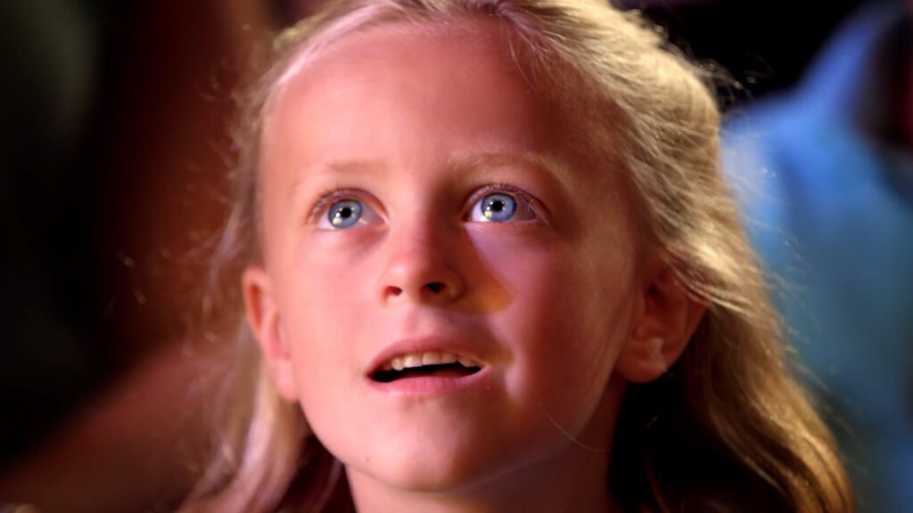 girl looking up in wonder